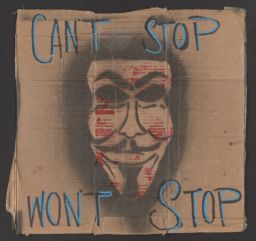 Protest sign with a Guy Fawkes mask