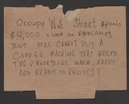 Cardboard sign requesting a coffee machine